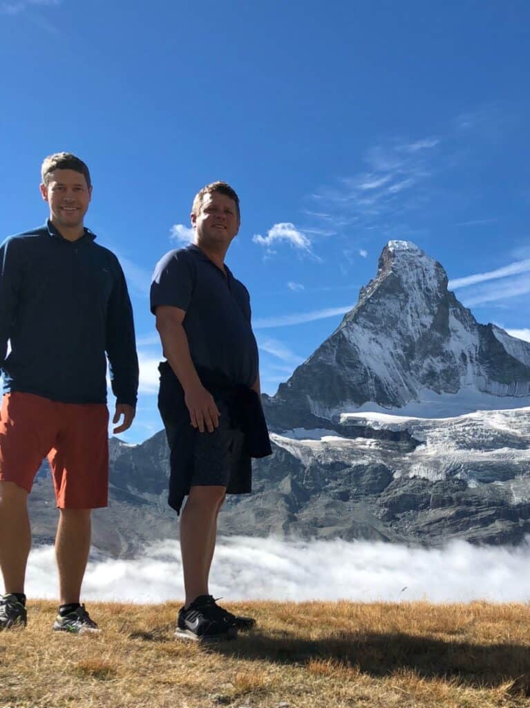 Hornblower and Schreiber in front of a mountainous landscape.