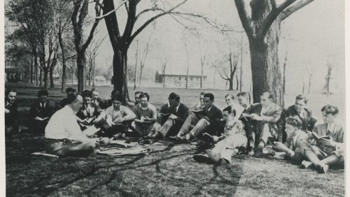Trinity College students in class outside, main quad