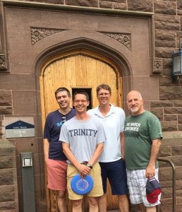 Four college roommates gathered for a guys’ weekend pictured outside Cook Hall at Trinity College.