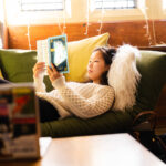 A trinity college student reading in their residence hall