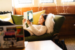 A trinity college student reading in their residence hall