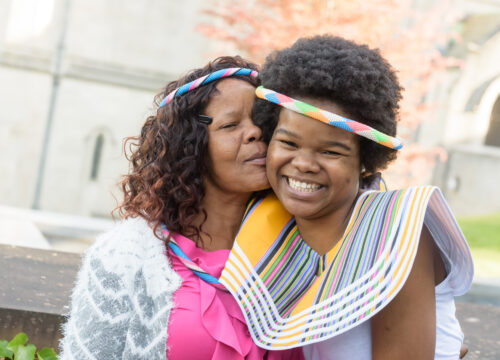 An international trinity college student with their family