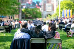 A 2021 Trinity College Graduate sitting with family