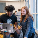 Two Trinity college students engaging in academics