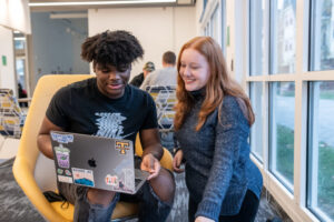 Two Trinity college students engaging in academics