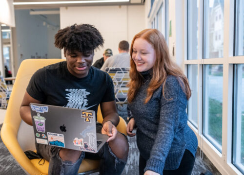 Two Trinity college students engaging in academics