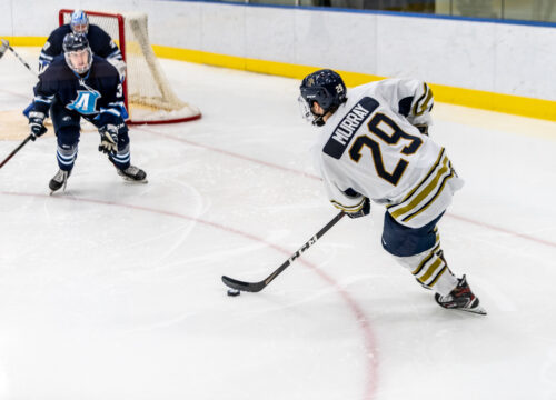 Trinity College mens Hockey player competing on ice