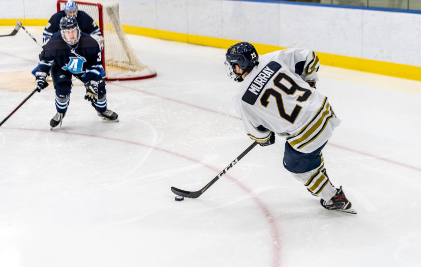 Trinity College mens Hockey player competing on ice