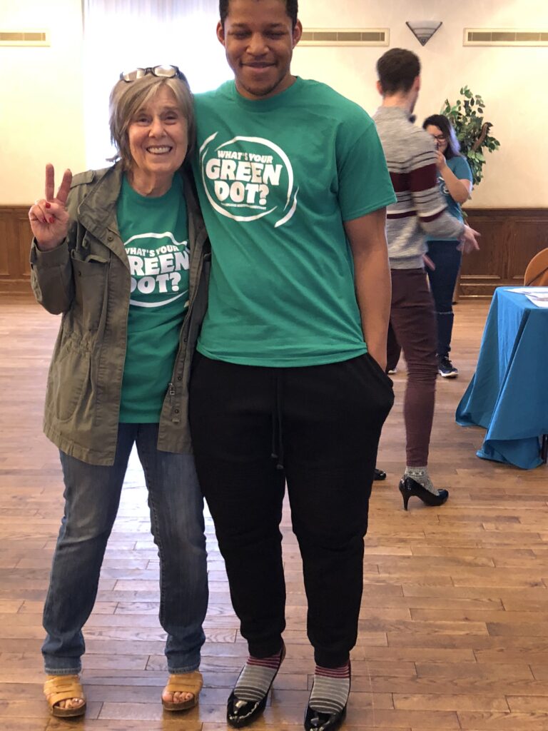 students wearing green shirts