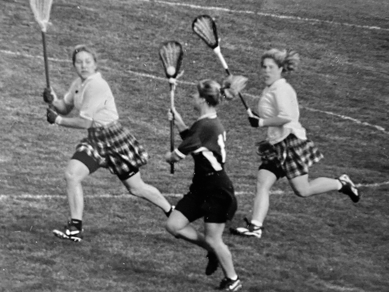 Jennifer Martinelli Hogan ’98 moves the ball down the field as a member of Trinity’s women’s lacrosse team. She served as a team co-captain and received All-American honors.