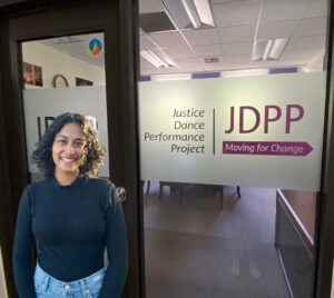 Aarti Lamberg in front of the Justice Dance Performance Project office