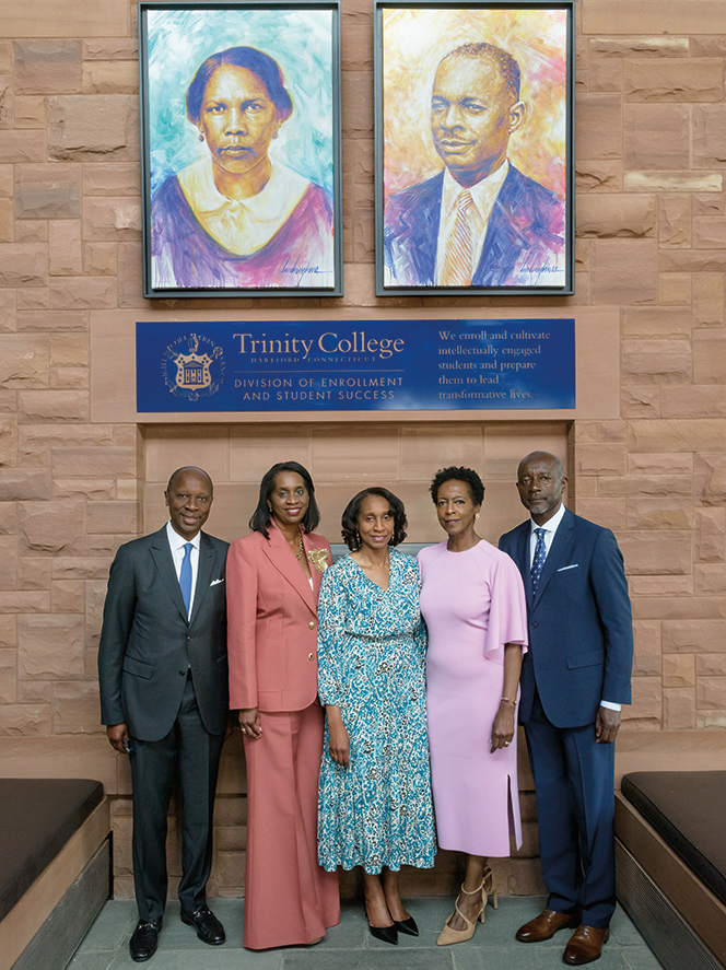 The Borges siblings: Francisco L. “Frank” Borges ’74, H’20, Joaquina Borges King, Maria Borges Correia ’85, Francesca Borges Gordon ’82, and Peter L. Borges ’80, stand beneath the portraits of Maria Louisa Lopes Borges and Manuel Borges, created by artist Luis Levy Lima.