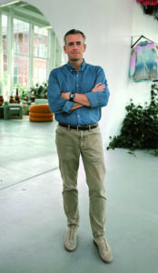 David Hayne wearing a button down and arms are crossed