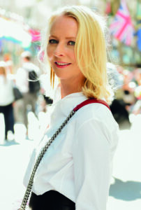Linda Wells with her left shoulder towards the camera wearing a white shirt