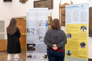 Visitors view an environmental justice exhibit at the Connecticut Museum.