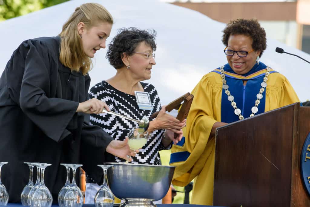 Student Government Association President Trinna T. Larsen ’20, Class of 1973 President Joyce Krinitsky, and Trinity College. President Joanne Berger-Sweeney prepare the lemon squeezer toast. 