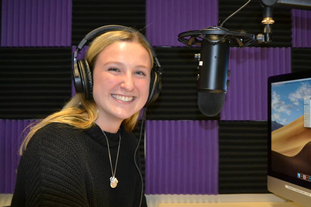 Emily Wickles ’20 recording in a Story Lab podcast studio.