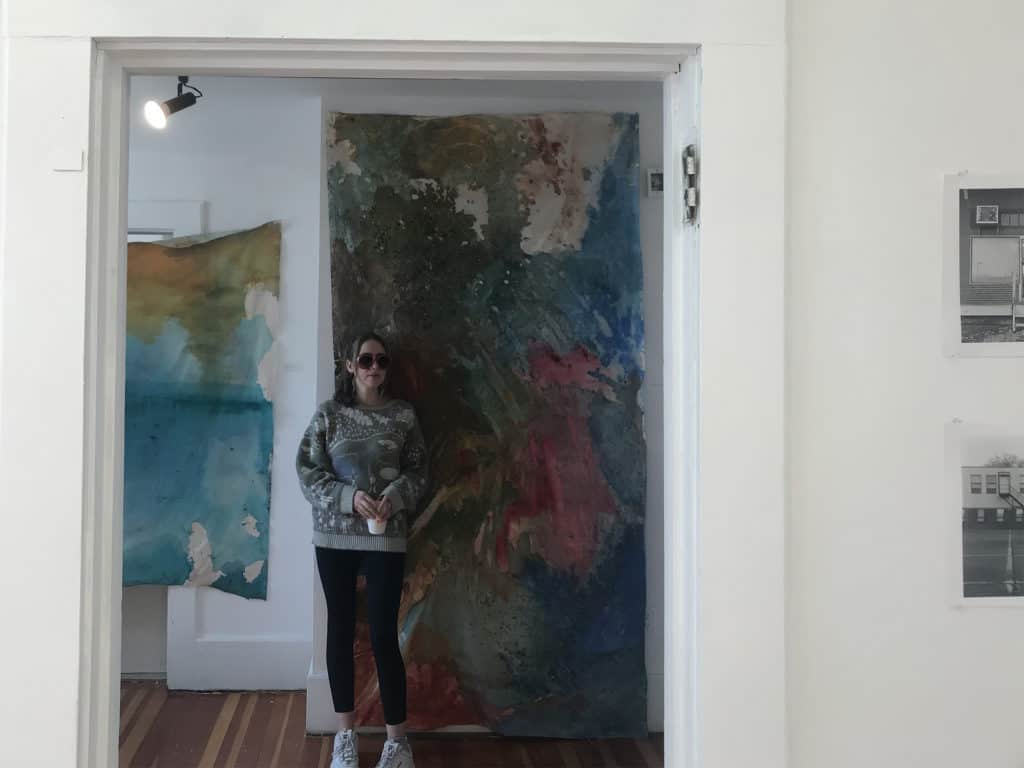 Artist Alison Cofrancesco ’20 in The Mill’s student art gallery.