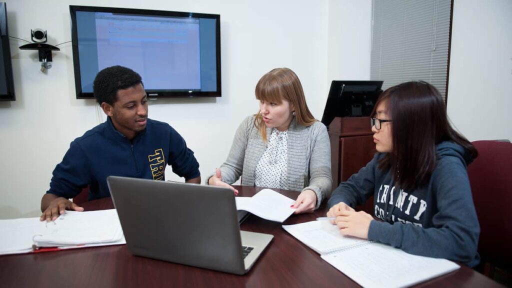 Associate Professor of Computer Science Ewa Syta working with Trinity students.