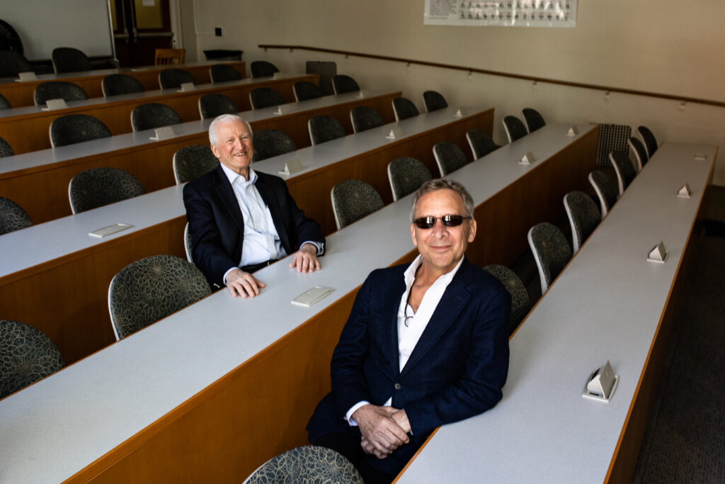 Henry DePhillips, Vernon K. Krieble Professor of Chemistry, Emeritus, with Gregory Mario ’87 in a chemistry lab. 