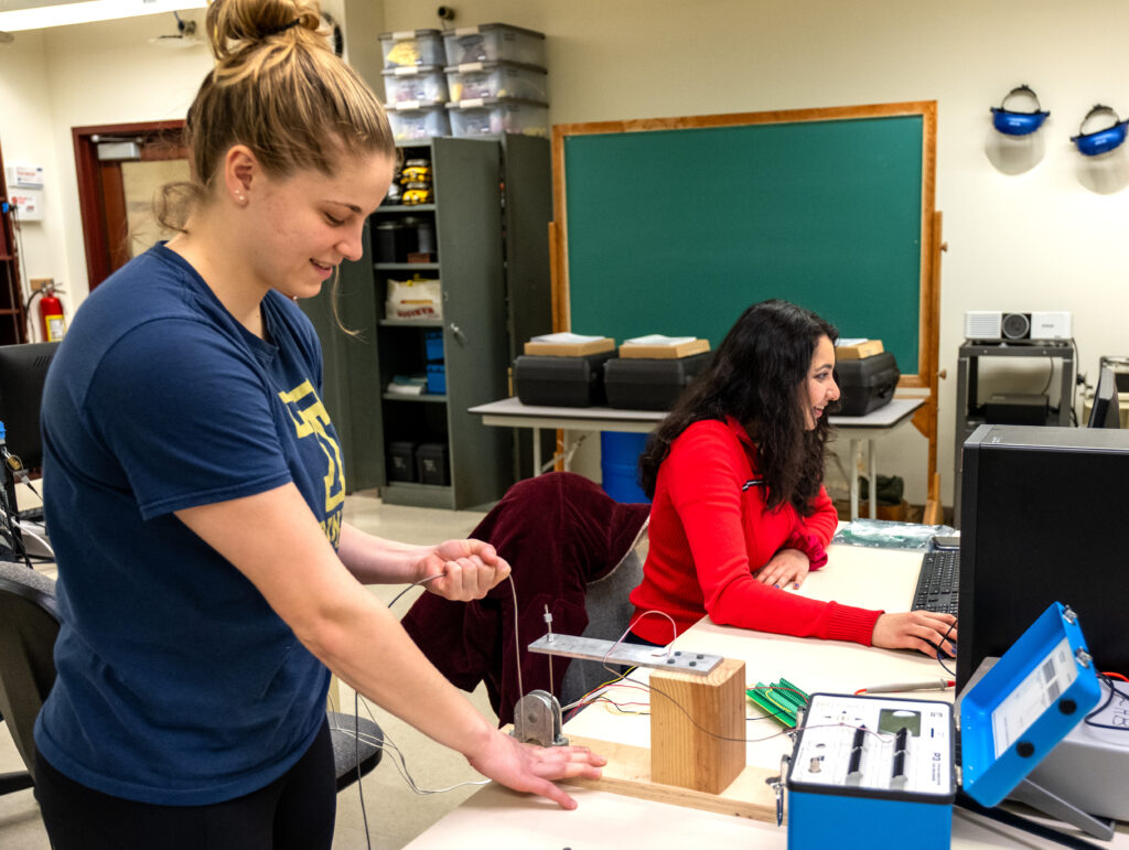 Scarlett Gillette ’23 and Ananya Swamy ’23 test one of their project's systems. 