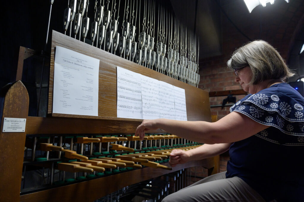 Ellen Dickinson, college carillonist, plays the 49-bell Plumb Memorial Carillon in the Trinity College Chapel. 