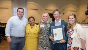 Joining Daniel Korengold ’73, P’09, ’12, ’14, ’18 (holding his award citation) during the Class of 1973’s 50th Reunion dinner are, from left, Steven Armanetti ’18, Trinity President Joanne Berger-Sweeney, Martha Dippell P’09, ’12, ’14, ’18, and Hannah “Greer” Korengold ’18.