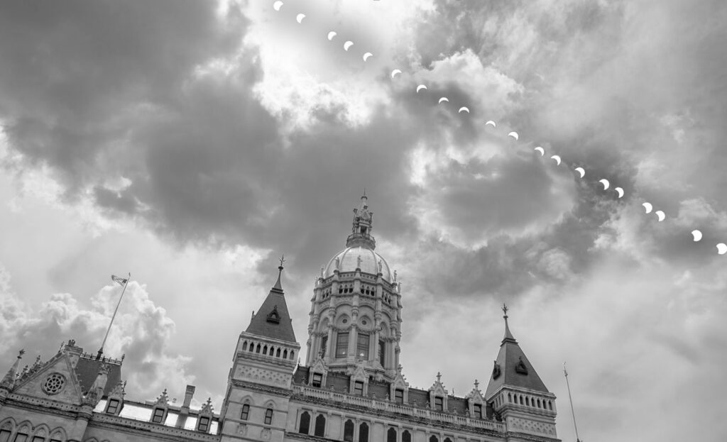 solar eclipse over Connecticut State Capitol.