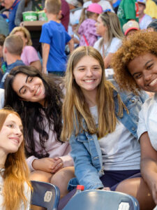 Students take a selfie at a baseball game