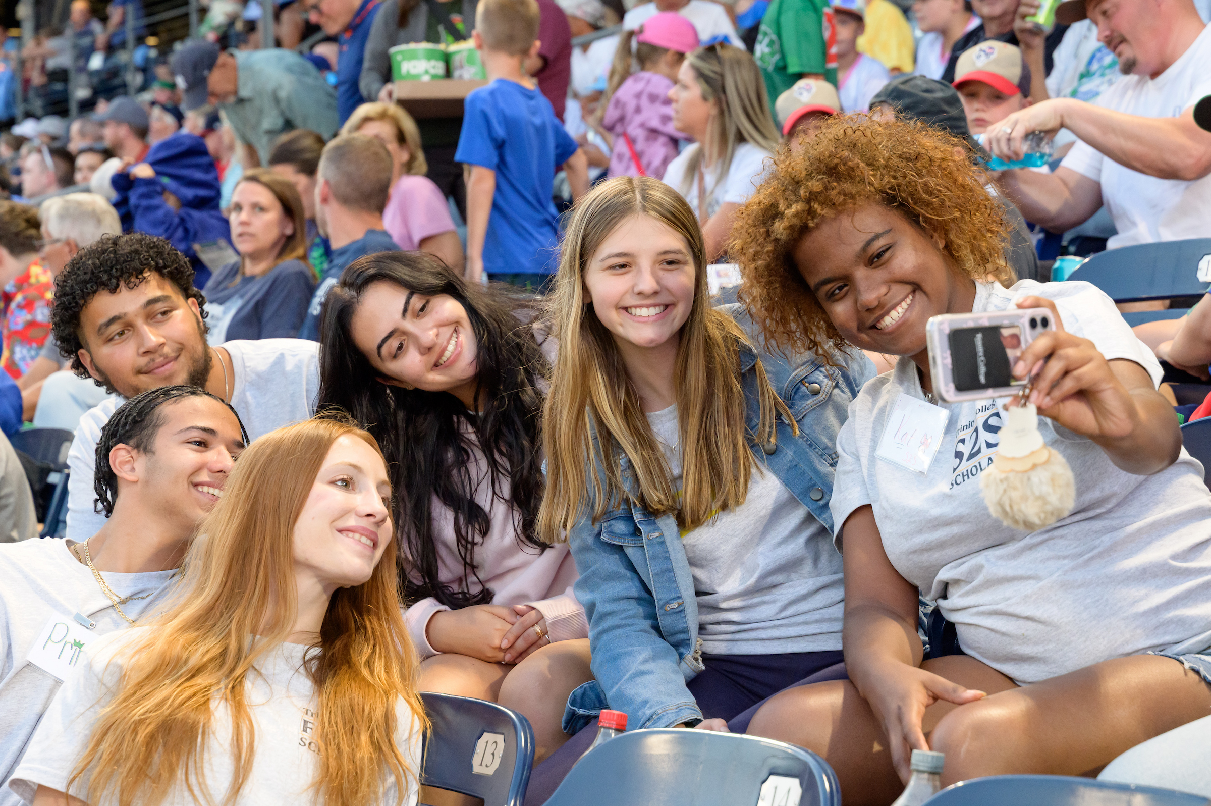 Students take a selfie at a baseball game