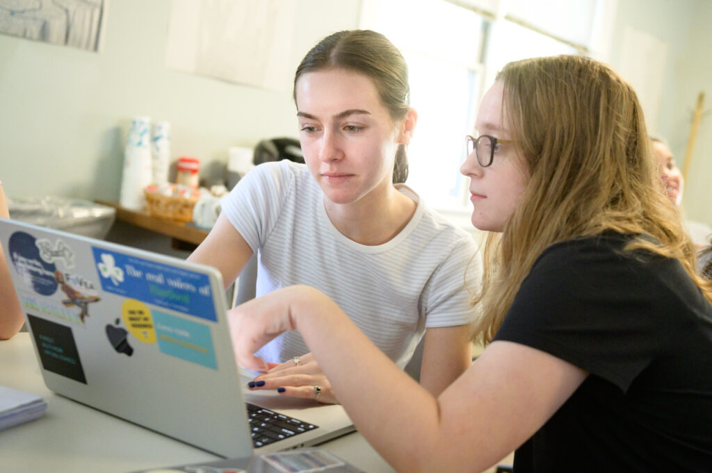 Peer tutors work with fellow students at The Writing Center. Photo by Nick Caito.