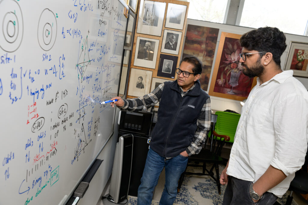 Senior Lecturer in Physics Kalum Palandage and Shivanshu Dwivedi ’26.