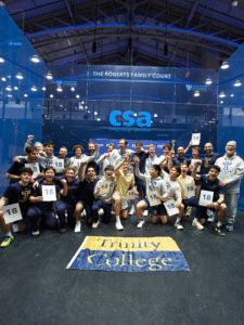 Men's squash team pose together holding signs that say "18"