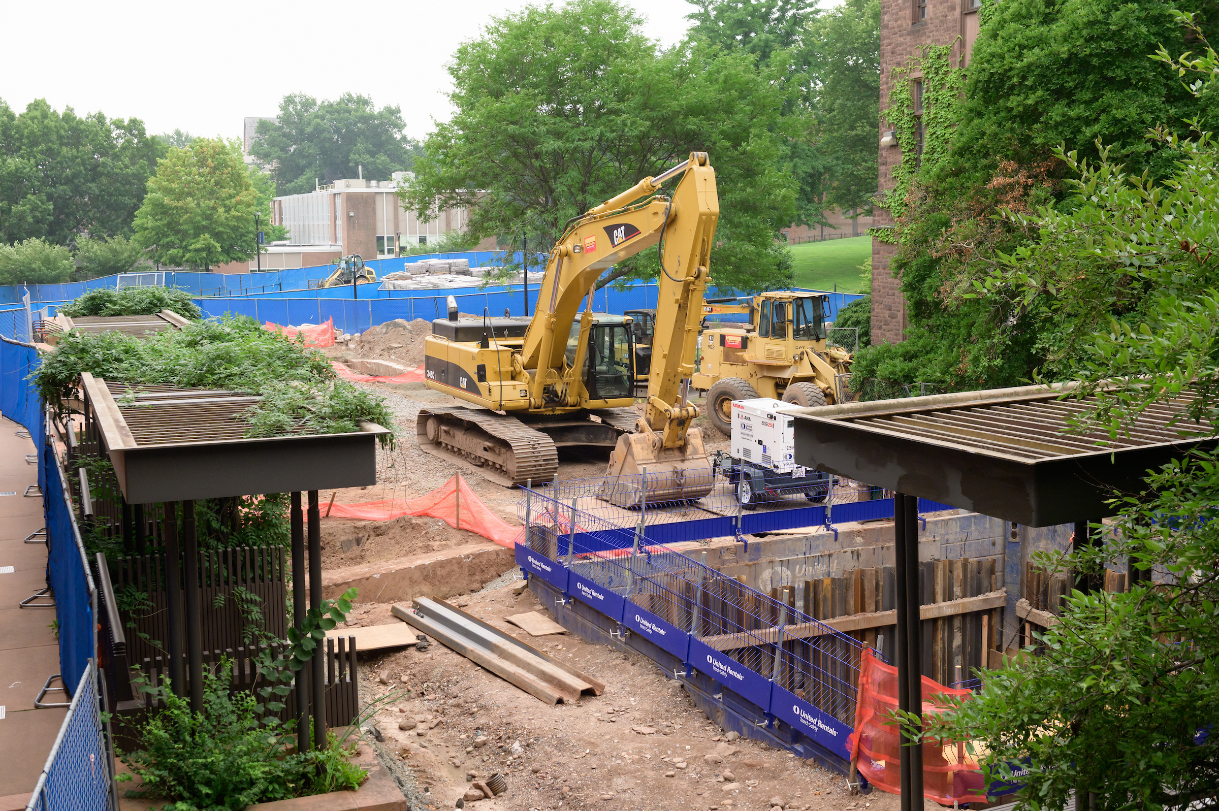 Heavy machinery digs a hole