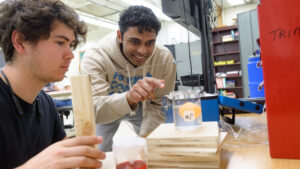 Two liberal arts students working in an Engineering Fluid Mechanics Lab