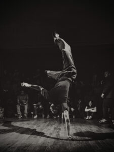 A hip hop dancer on one hand