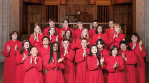 The Chapel Singers pose for a photo in their red robes